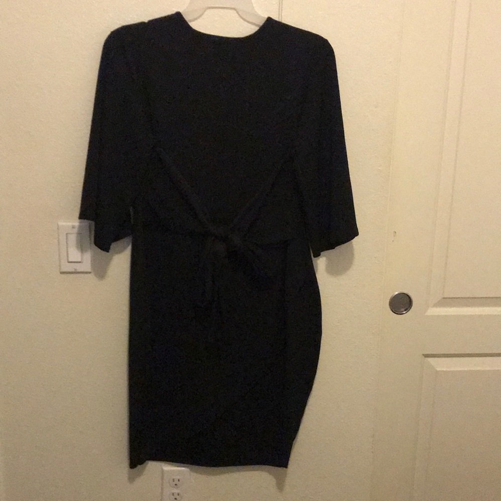 This is a dress that ties into a bow in the tummy section..